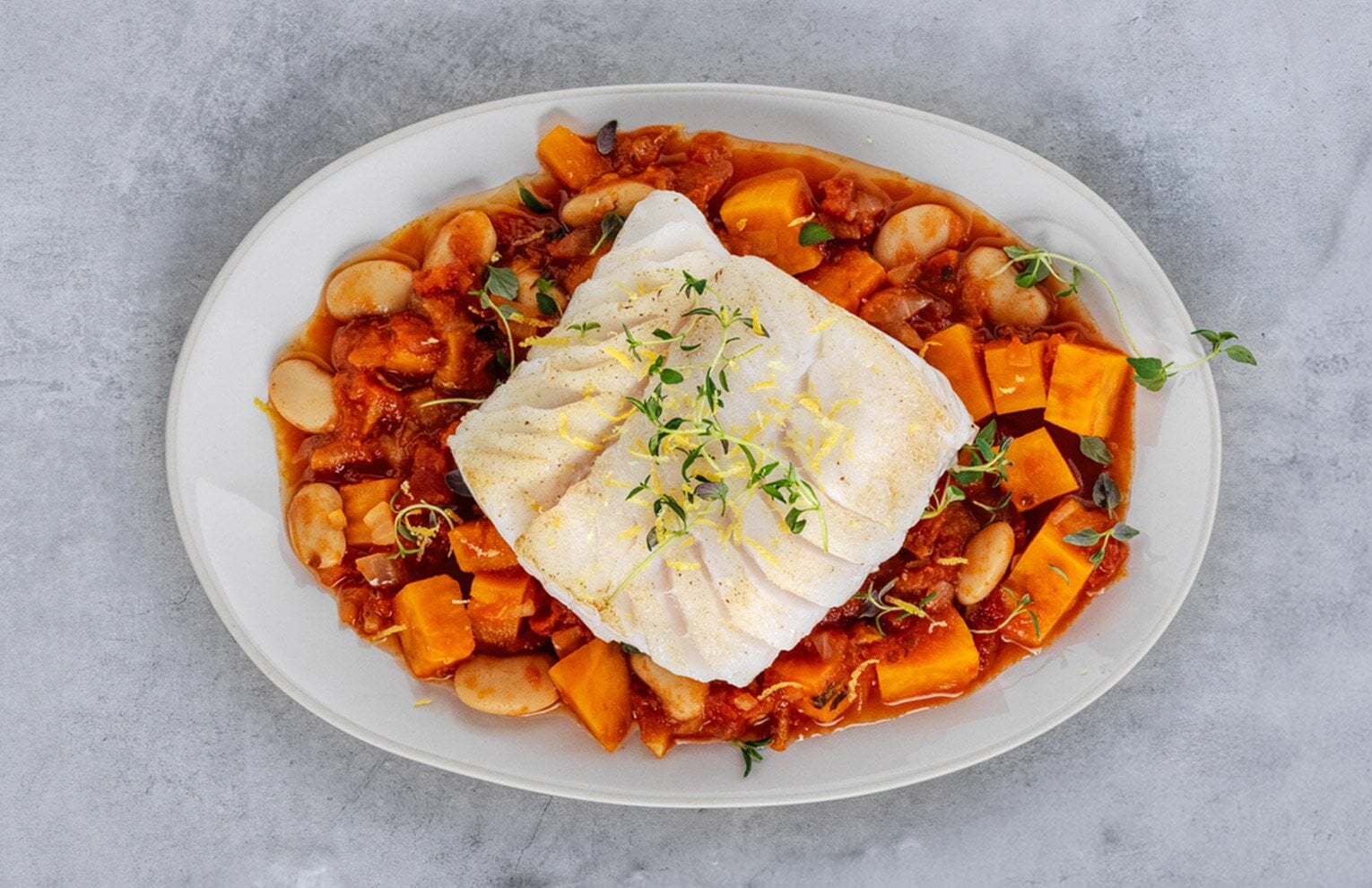 Skrei sauterad med bönor, sötpotatis och timjan 